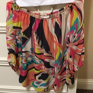Multi colored silk off-shoulder blouse.